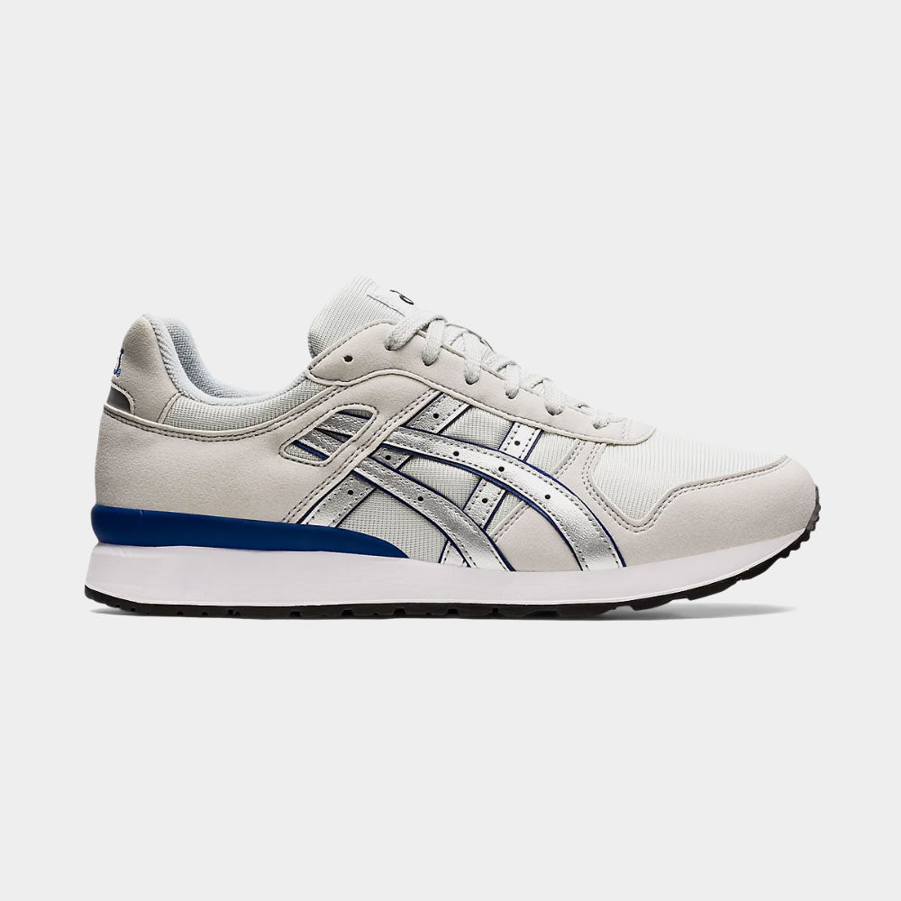 White sneaker with blue accent on a light gray background