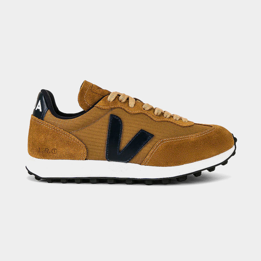Brown sneaker with black accents on a light gray background