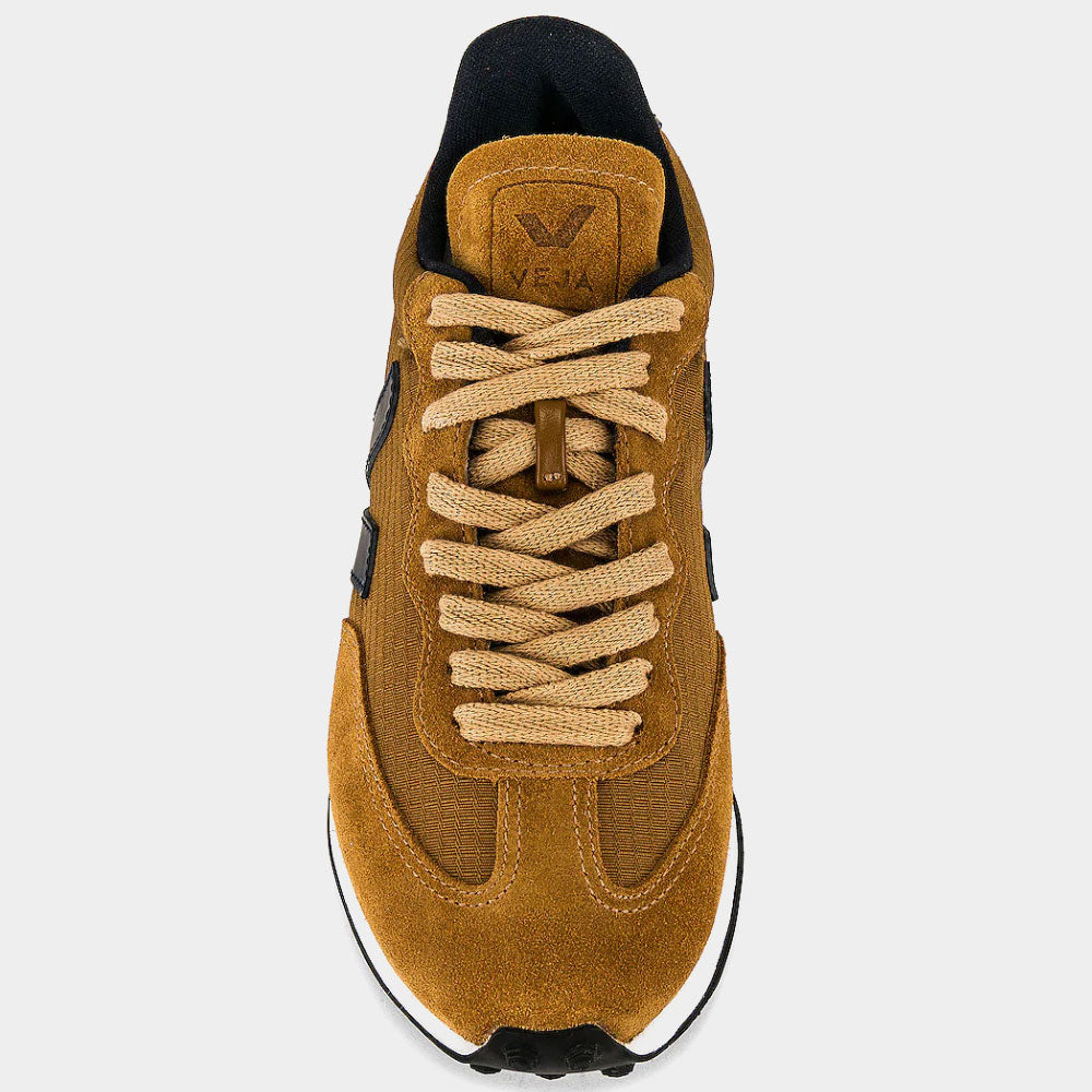 Brown sneaker with black accents on a light gray background