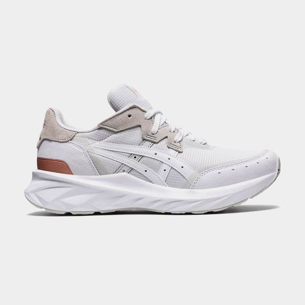 White sneaker with brown accents on a white background