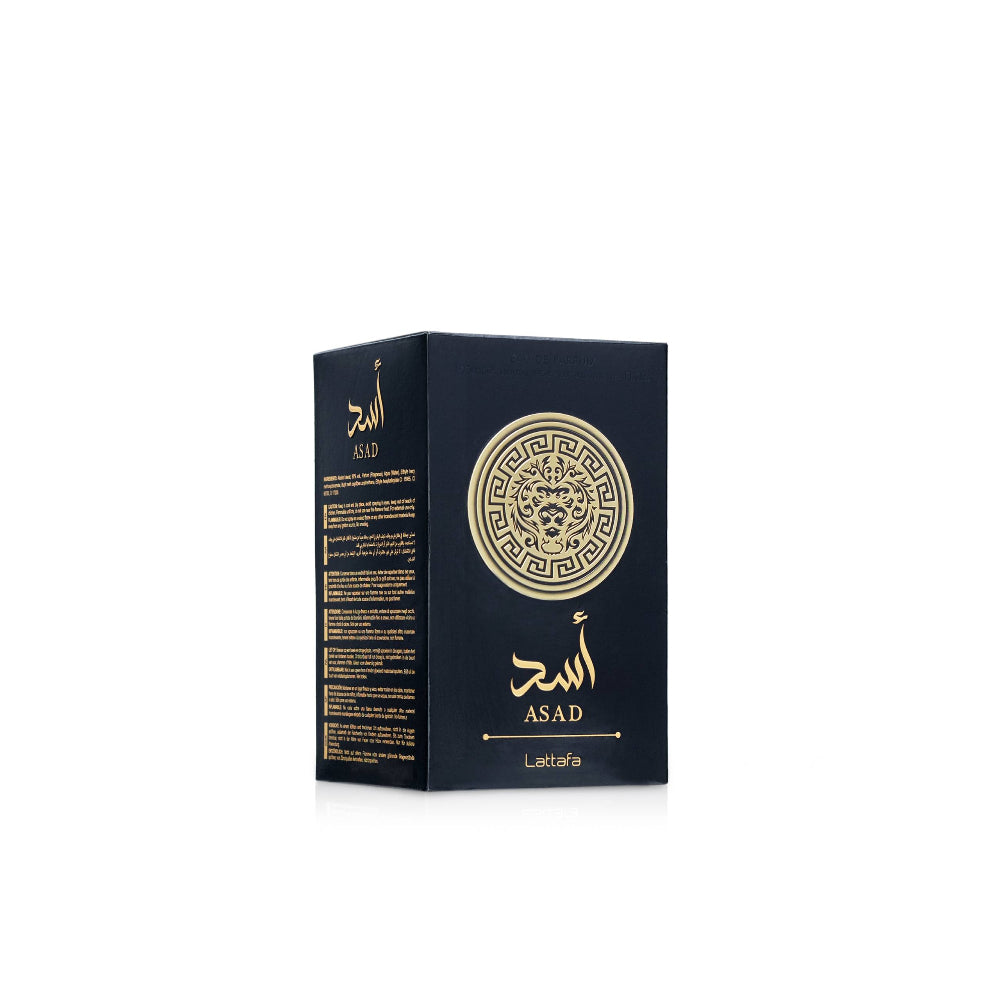 Black and gold perfume bottle with packaging on a white background