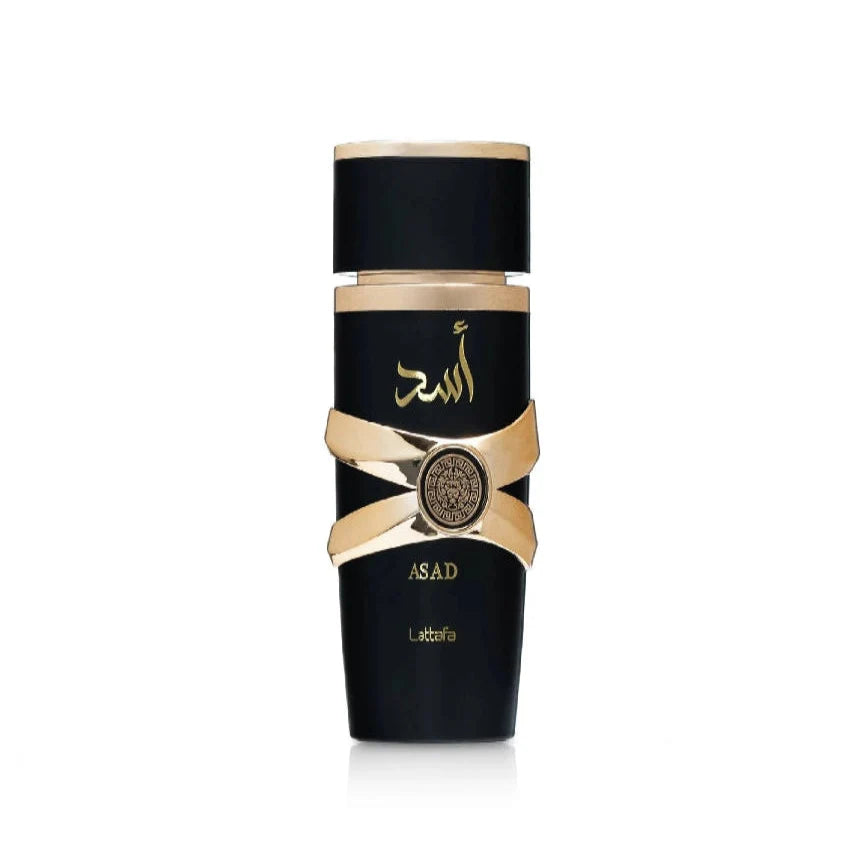 Black perfume bottle with gold accents on a white background